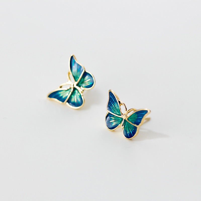 Boucles d'oreilles papillon bleues et dorées